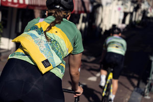 A woman A cyclist wearing the jersey and musette from the Rapha x Van Gogh Museum capsule collection 2022. Photo: Stan Koolen